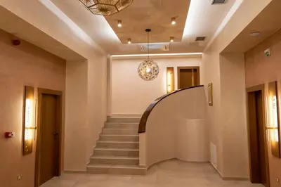 a spiral staircase in a building with a ceiling at Motel & Restoran Sunce in Busovača