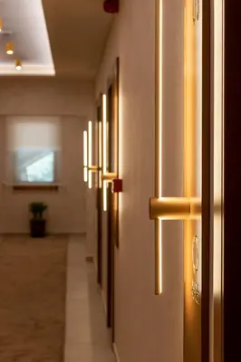 a hallway with a row of lights on the wall at Motel & Restoran Sunce in Busovača