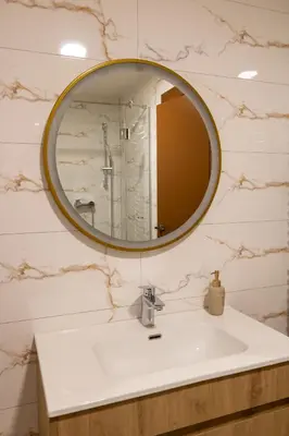 a bathroom with a sink and a mirror at Motel & Restoran Sunce in Busovača