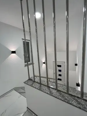 a room with white walls and a mirror at Apartmani Venecia in Prozor