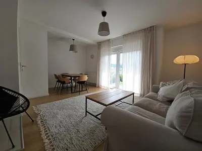 a living room with a couch and a table at Apartment DANICA in Banja Luka