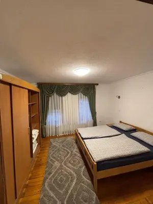a bedroom with two beds and a window at Luni in Travnik