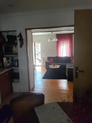 a living room with a couch and a table at Luni in Travnik