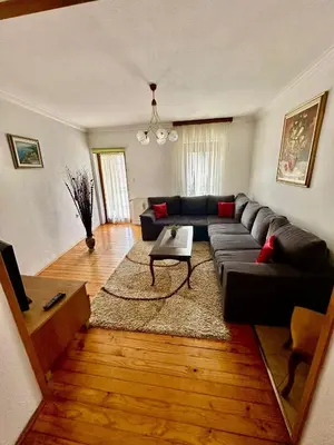 a living room with a couch and a table at Luni in Travnik