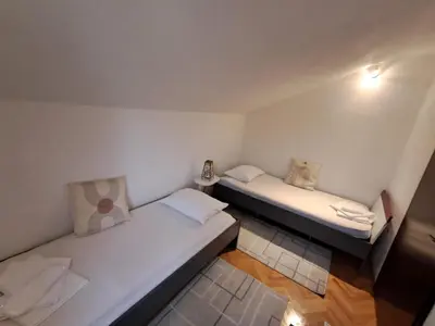 a small room with two beds in it at Kuca za odmor Amber in Bihać