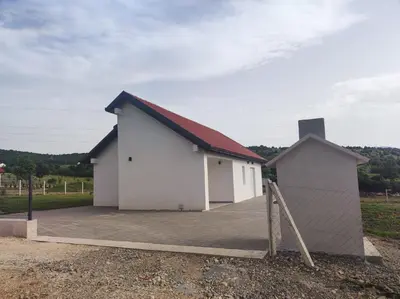 a white building with a red roof at Antiva in Livno