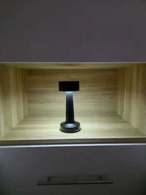 a small lamp sitting on top of a wooden shelf at Apartmаn Avram ll in Kotor-Varoš