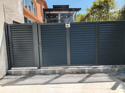 a gate in front of a house at Apartman Kenan in Bihać