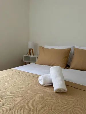 a bed with two towels sitting on top of it at Jelena in Jajce