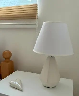 a white lamp sitting on a table next to a mouse at Jelena in Jajce
