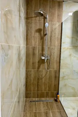 a shower with a shower head in a bathroom at Jelena in Jajce