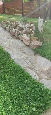 a stone walk way with a pile of rocks at Pyramid Holiday House in Visoko
