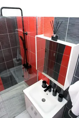 a bathroom with a sink and a shower at Apartman Kiko in Jajce