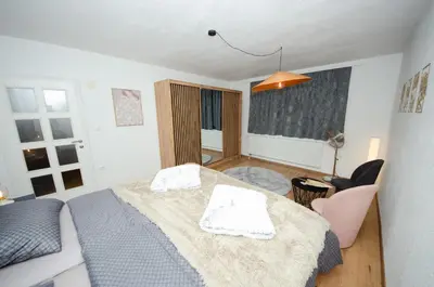 a bedroom with a bed with two towels on it at Apartment Center Korzo in Bihać