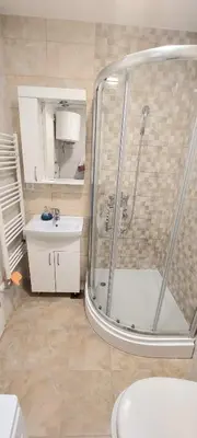 a bathroom with a shower and a sink at Apartman Aura in Bosanska Gradiška