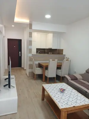 a living room with a couch and a table at SMART LUX Apartment in Modriča