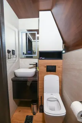 a bathroom with a white toilet and a sink at Vikendica Villa Natasa in Banja Luka