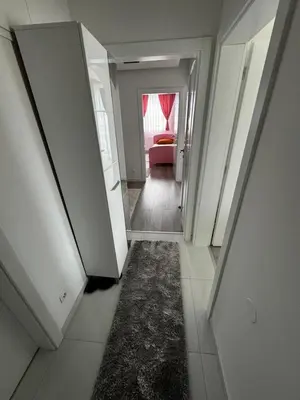 a hallway with a hallway leading to a living room at Asya Art in Bihać