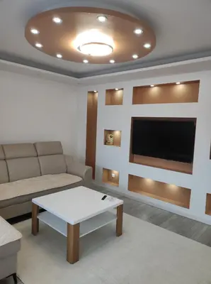 a living room with a couch and a flat screen tv at Asya Art in Bihać