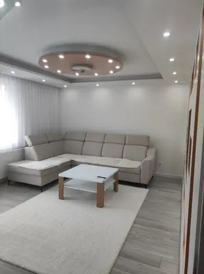 a living room with a couch and a coffee table at Asya Art in Bihać