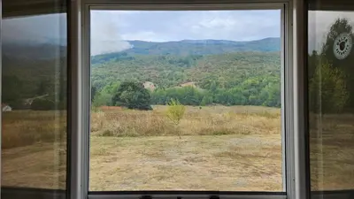 a window with a view of a mountain view at Livanjsko Polje Cottage #14 in Lusnić