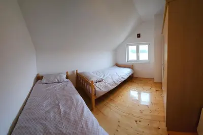 a bedroom with two beds and a window at Livanjsko Polje Cottage #14 in Lusnić