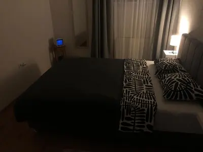 a bedroom with a bed with two pillows on it at Travnik Nostalgia Apartment in Travnik