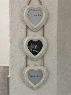 two hearts on a wall with the words transmit andwelcome at Travnik Nostalgia Apartment in Travnik