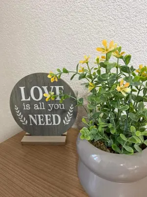 a toilet with a sign that says love is all you need at Travnik Nostalgia Apartment in Travnik