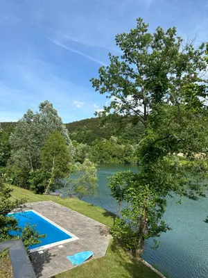 an image of a lake with a swimming pool at Villa Vigo in Bosanska Krupa