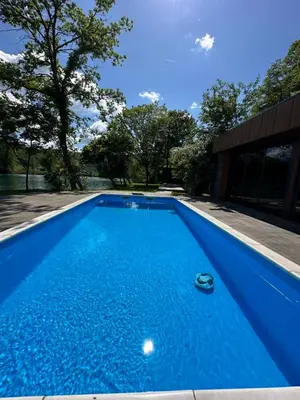 a blue swimming pool in a yard at Villa Vigo in Bosanska Krupa