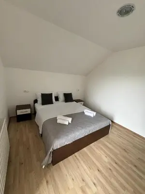 a bedroom with a bed with two towels on it at Ivan in Livno