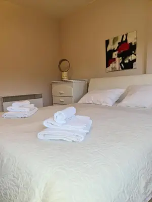 two towels are sitting on top of a bed at Alex Bl in Banja Luka