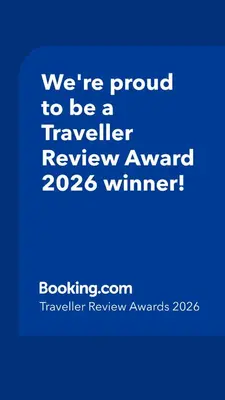 a blue sign that says were proud to be a traveller reviewagency winner at Banja Apartman in Tuzla
