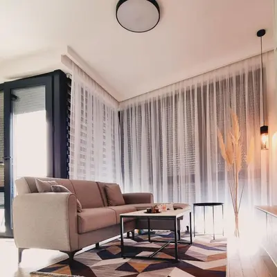 a living room with a couch and a table at Banja Apartman in Tuzla