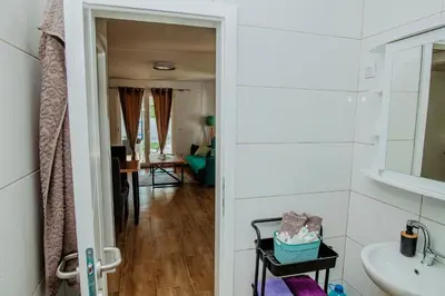 a bathroom with a sink and a mirror at Kuća za odmor Vučjak in Bihać