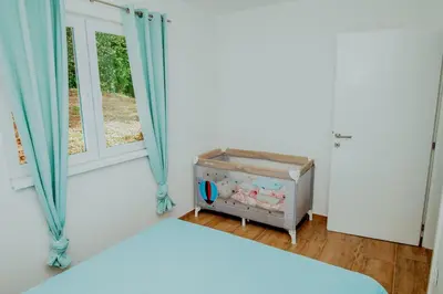 a bedroom with a bed and a window at Kuća za odmor Vučjak in Bihać