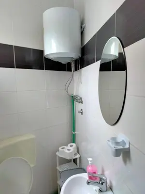 a bathroom with a sink and a mirror at Kumalic 2 in Sanski most