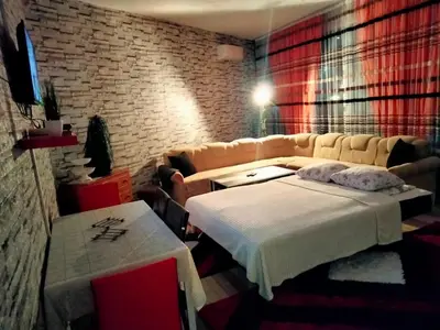 a living room with a bed and a couch at Kumalic 2 in Sanski most
