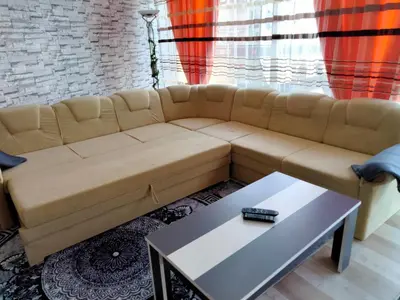 a living room with a couch and a table at Kumalic 2 in Sanski most