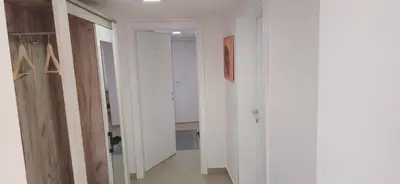 an empty hallway with white walls and a door at Apartmani Teša in Tešanj