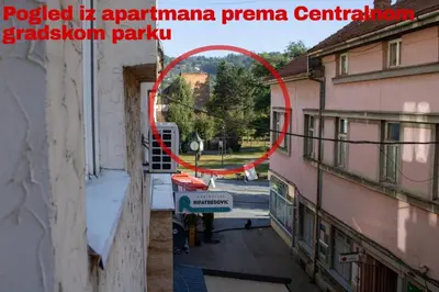 a view from a balcony of a building with a red circle at Apartment Stari Grad Korzo Tuzla in Tuzla