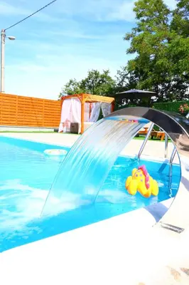 a water slide in a swimming pool with a rubber duck at Villa Crystal in Bihać