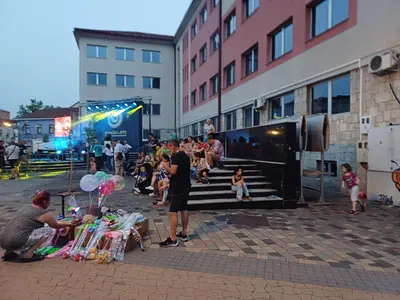 a group of people standing around a table with balloons at Zen3 Studio app in Bihać
