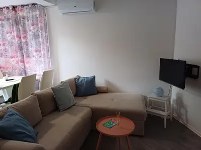 a living room with a couch and a tv at Zen3 Studio app in Bihać