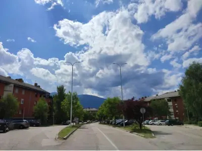 a street with two street lights and a cloudy sky at Zen3 Studio app in Bihać