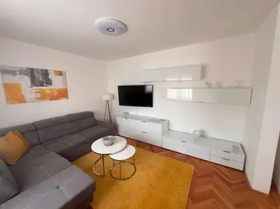 a living room with a couch and a table at Appartement Nada in Bosanski Brod