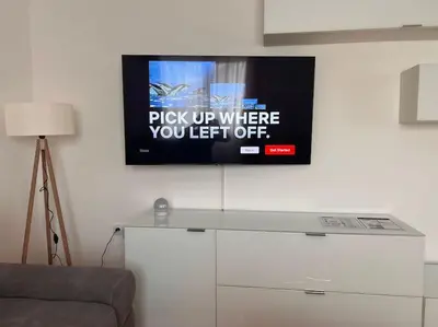 a flat screen tv hanging on a wall at Appartement Nada in Bosanski Brod