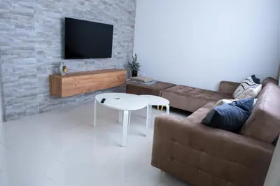 a living room with a couch and a table at Apartment Milla in Tomislavgrad