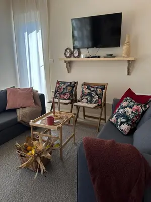 a living room with two couches and a tv at Kuca Oste in Banja Luka